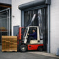 Forklift operator loading boxes onto a forklift in front of a warehouse door.